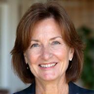 Professional headshot of Claire Thompson, a smiling woman with warm eyes, suitable for a health coach profile.